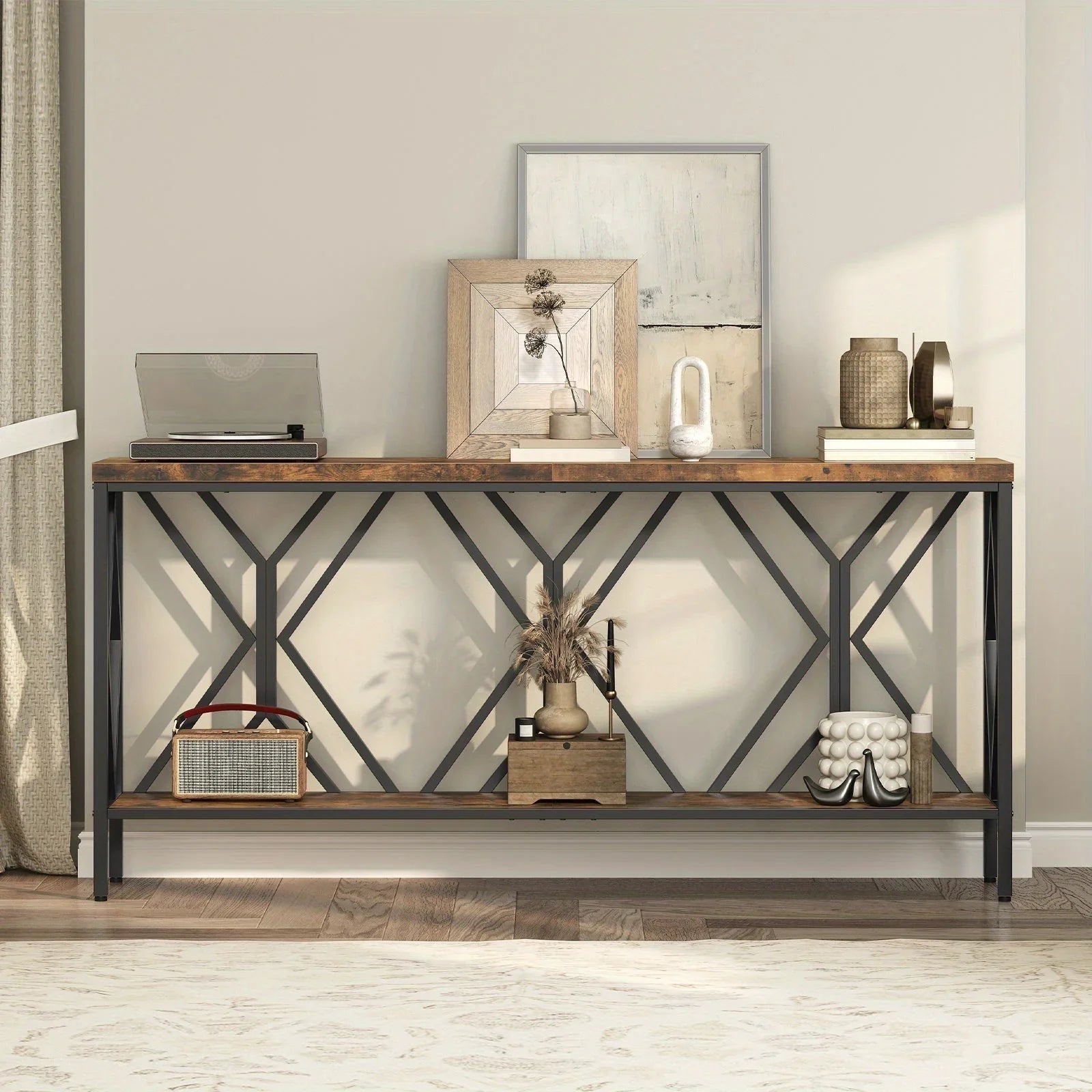 Modern console table with wood and metal frame, styled with decorative vases, artwork, and record player