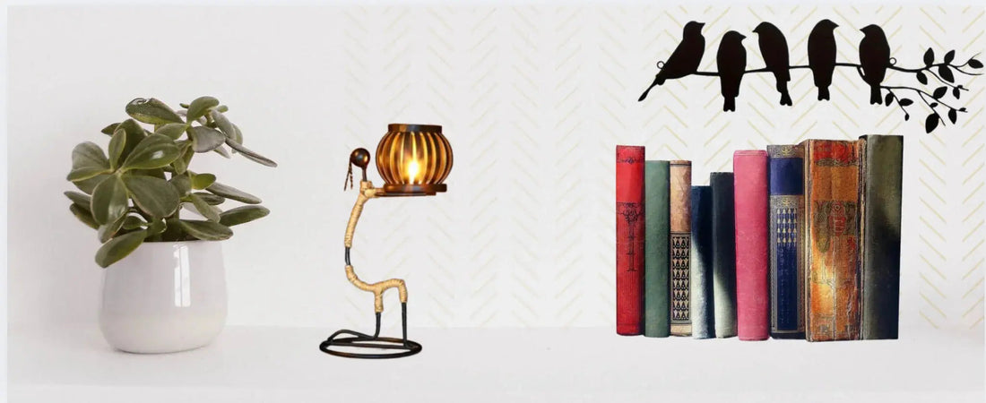 Minimalist white shelf with green potted plant, vintage lamp, colorful books, and bird wall decal