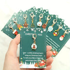 10 Christmas Themed Keychains, with Designs of Santa Claus, Snowman, Gingerbread Man, Bells, Reindeer, Etc., with Christmas Hug Greeting Card Blessings. This Is a Small Christmas Hug, Suitable As a Holiday Gift for Relatives House Of Avana