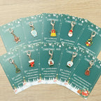 10 Christmas Themed Keychains, with Designs of Santa Claus, Snowman, Gingerbread Man, Bells, Reindeer, Etc., with Christmas Hug Greeting Card Blessings. This Is a Small Christmas Hug, Suitable As a Holiday Gift for Relatives House Of Avana