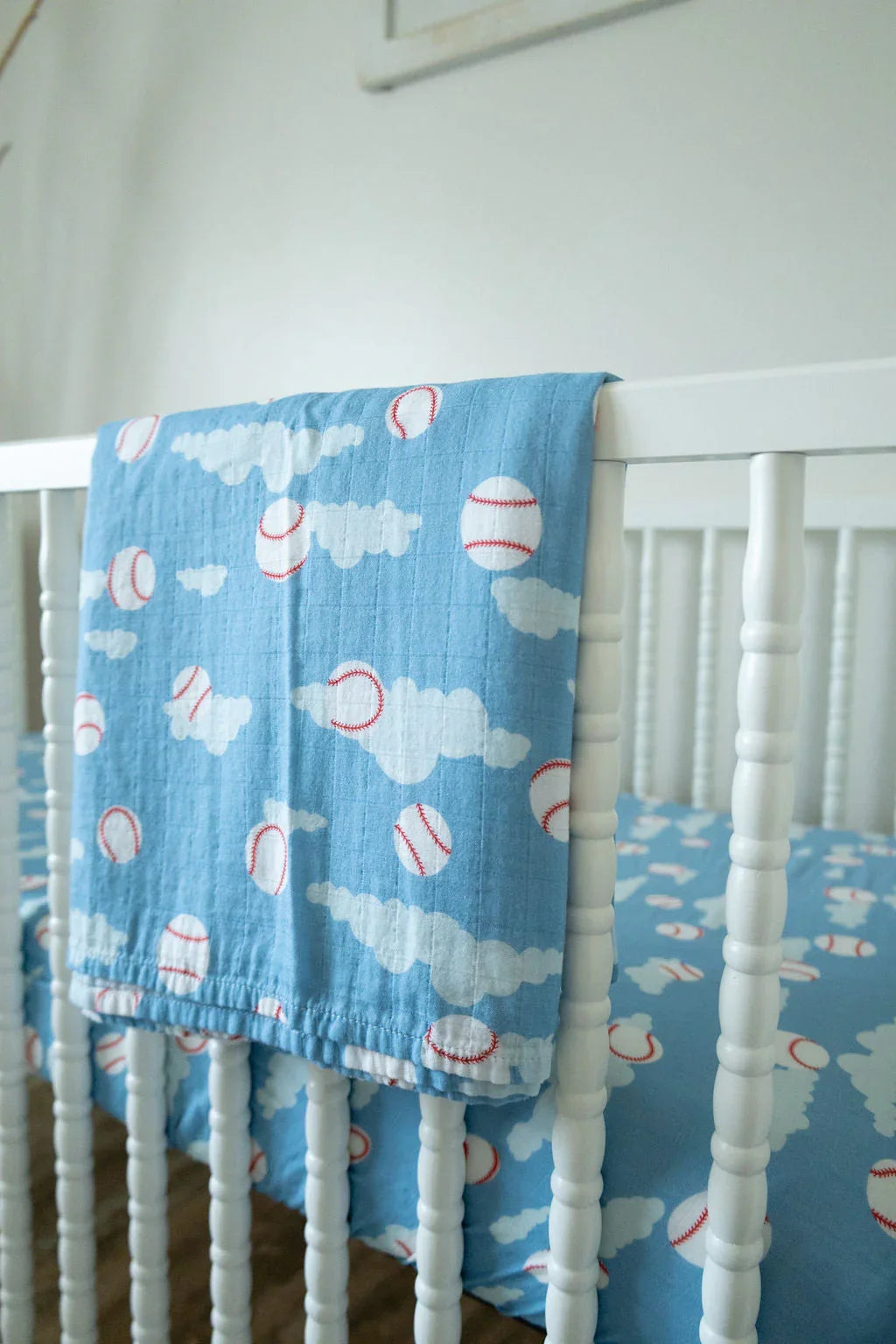 Organic Bamboo Cotton Muslin Crib Sheet in Baseballs in the Sky Cradle Comforts Co.