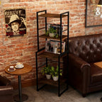 Room interior with a bookshelf, sofa, and small table against a brick wall.
