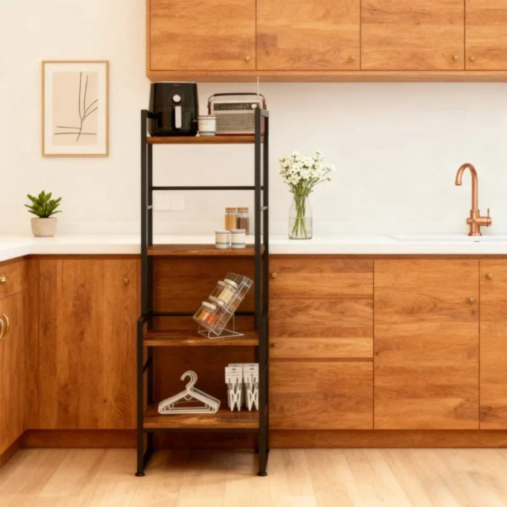 Kitchen with wooden cabinets, a black metal shelf, and various items on display.