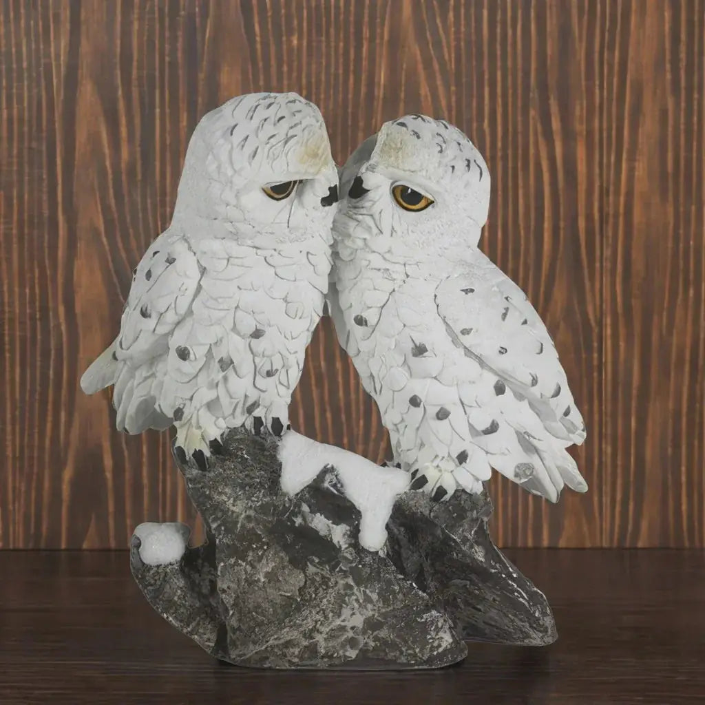 Two white snowy owls kissing on a snowy branch resin figurine for home decor. [[SKU:HOA-GSC-006]]