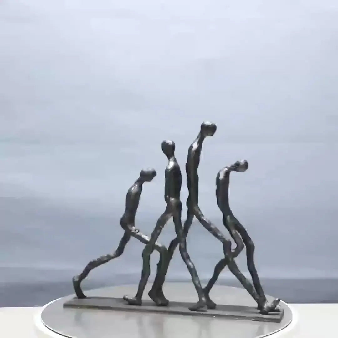 Modern Metal Sculpture - Minimalist Ascending Figures, angled view - House Of Avana