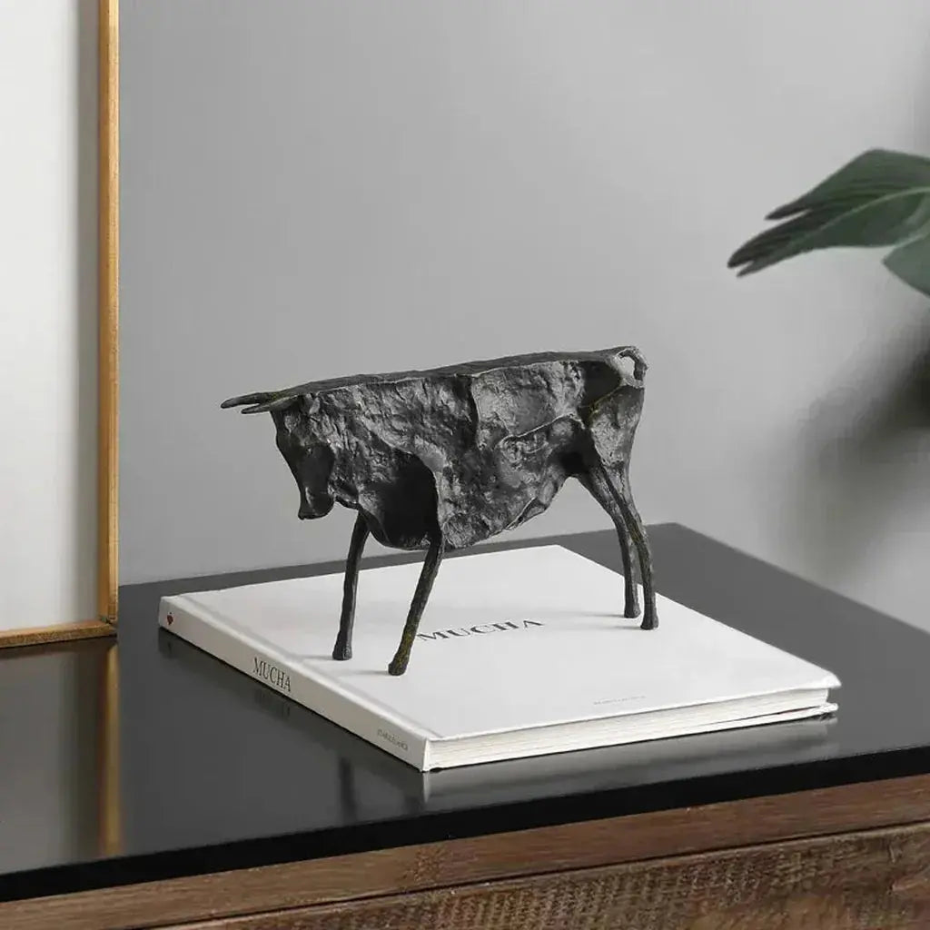 Matte black textured bronze bull statue with metallic finish featuring angular design for stylish home decor