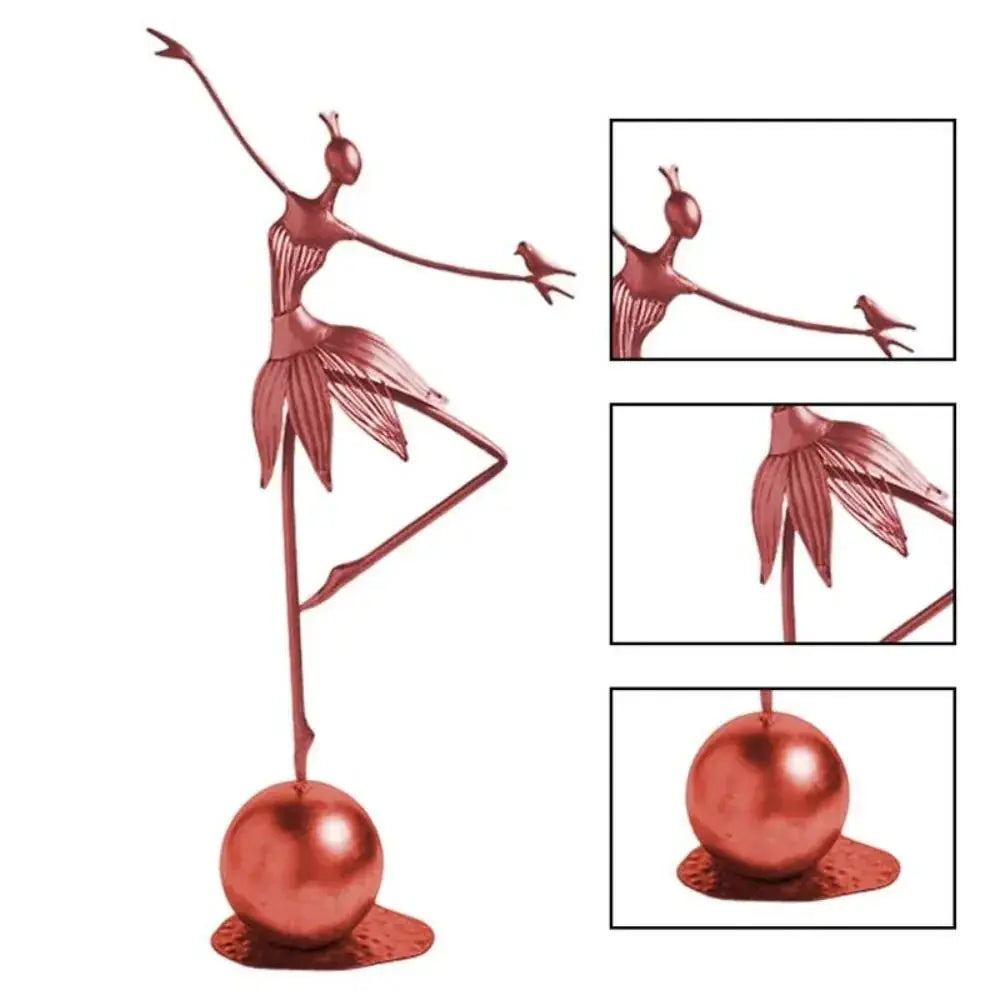 Rose gold abstract dancing ballerina metal sculpture figurine balancing on one leg holding a small bird