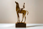 Bronze-colored abstract horse rider sculpture on a dark rectangular base decorative rider sculpture statue