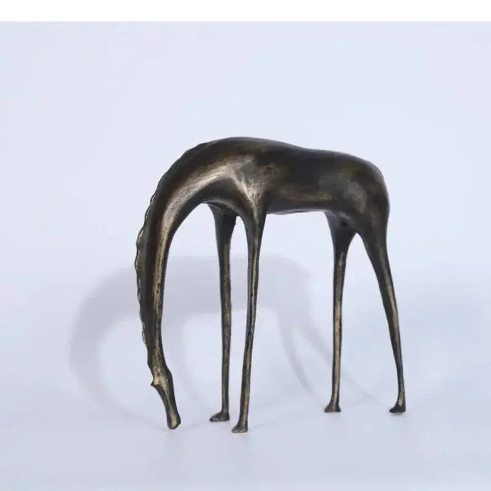 Bronze-colored abstract giraffe sculpture with slender legs and elongated neck for rustic living room decor
