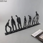 Abstract metal figure sculpture in black cast iron with sleek black base showcasing an elegant metal figure design