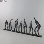 Set of seven abstract metal figures in unique poses with textured surfaces made of black cast iron sculpture