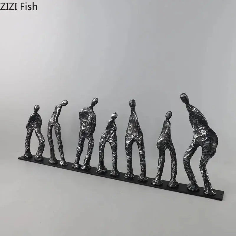 Set of seven abstract metal figures in unique poses with textured surfaces made of black cast iron sculpture