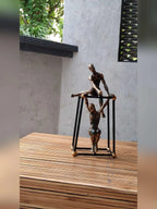 Abstract Bronze Sculpture - Two Figures Black Frame, angled view - House Of Avana