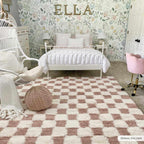Atira Pink Checkered Area Rug Hauteloom