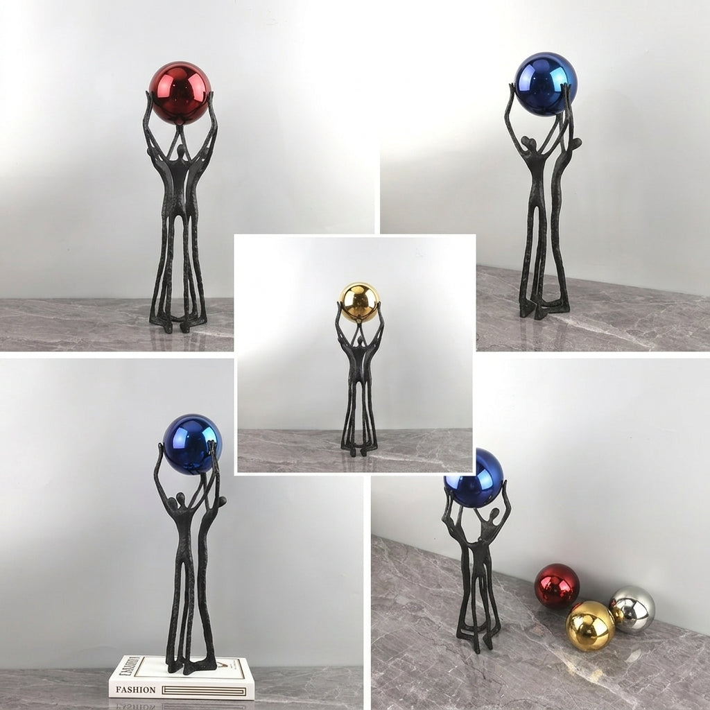 A collage showing a black figurative sculpture holding metallic decorative balls in different color options: red, blue, gold, and silver. The main view shows the black sculpture holding a red metallic ball, with other color variants displayed in inset panels on a gray marble-like surface against a light gray background.
