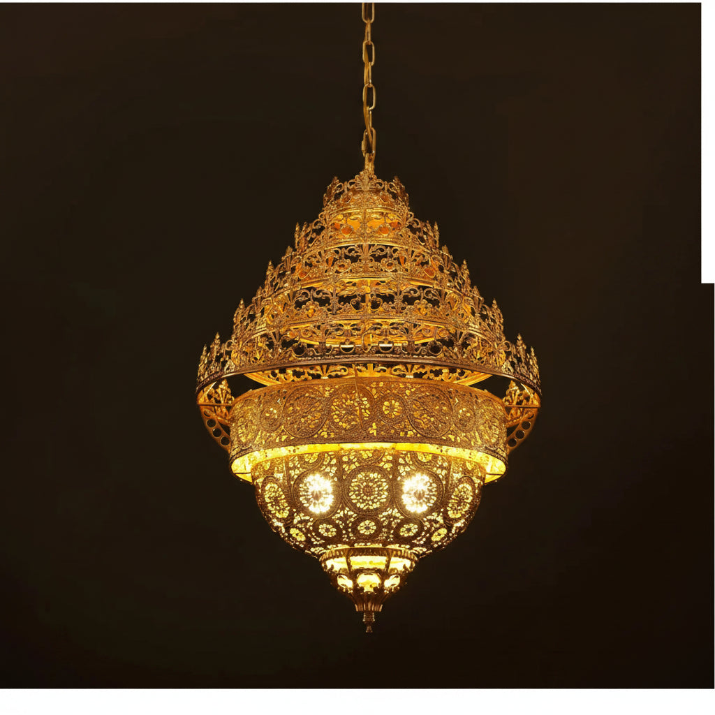 Ornate gold chandelier against a dark background