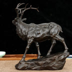 Bronze deer buck decorative sculpture with detailed antlers and textured body on rocky base for living rooms