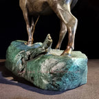 Bronze ram decorative sculpture with a textured rocky green stone base for living room tabletop decor