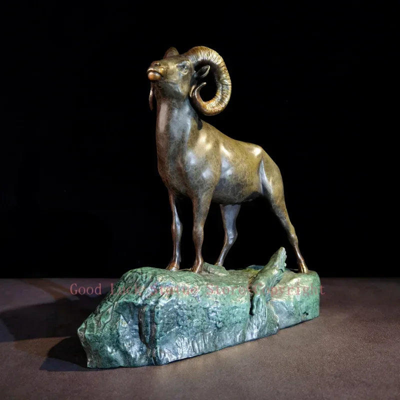 Bronze ram decorative sculpture with detailed curved horns standing on a textured rocky base for living room decor