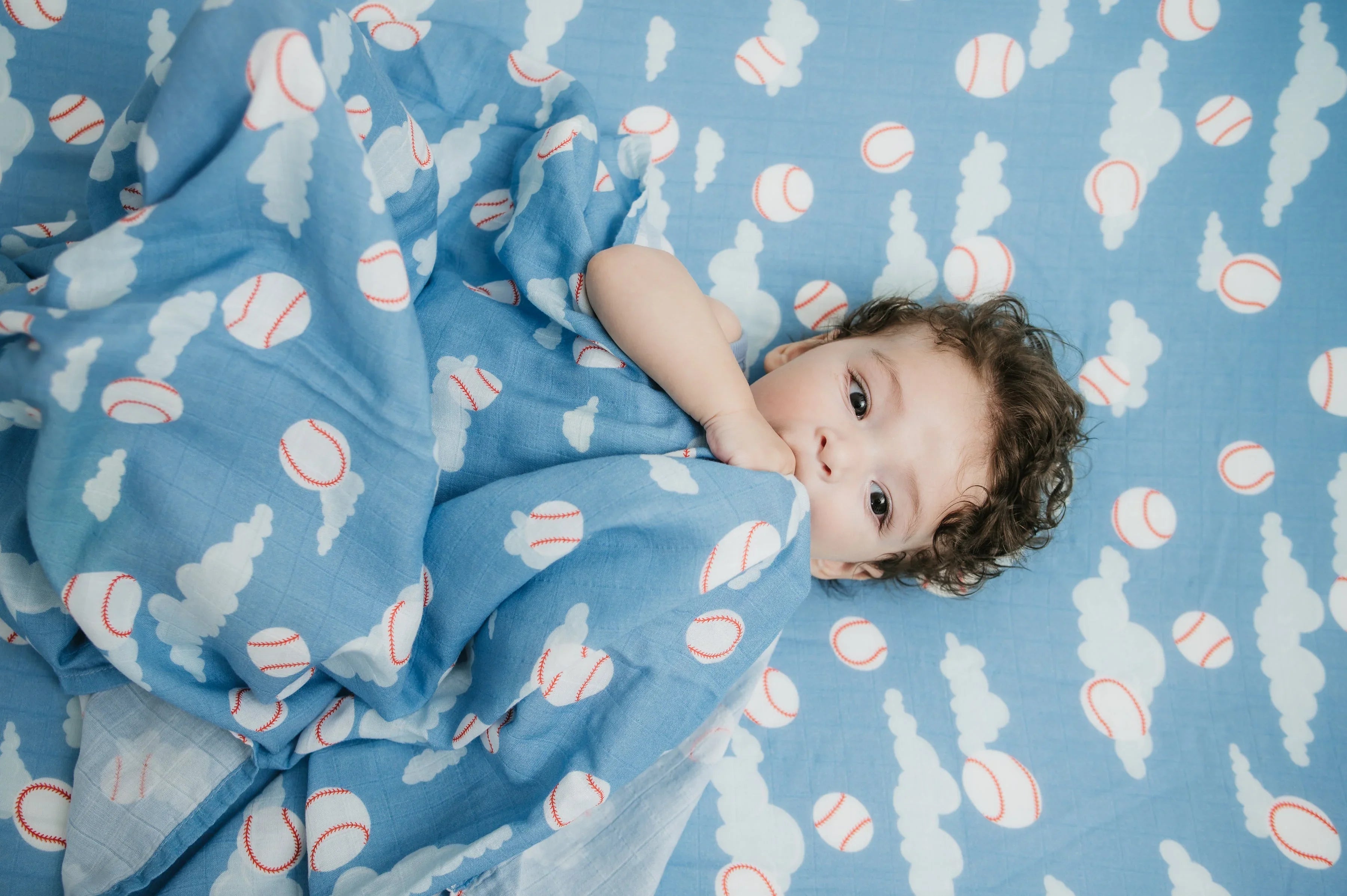 Organic Bamboo Cotton Muslin Crib Sheet in Baseballs in the Sky Cradle Comforts Co.