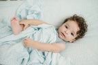 Organic Bamboo Cotton Muslin Swaddle Blanket in Crashing Sea Waves Cradle Comforts Co.