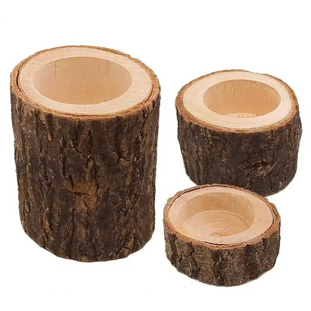 Three rustic wooden mini candle holders with natural bark exterior and smooth inner surface for candles