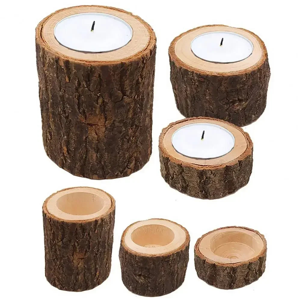 Set of rustic wooden mini candle holders with natural bark texture holding white tea light candles