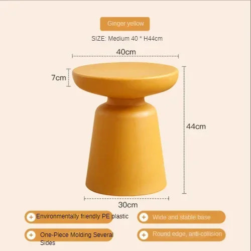 Ginger yellow coffee table stool with smooth rounded design and wide stable base made of eco-friendly pe plastic for living room compact size