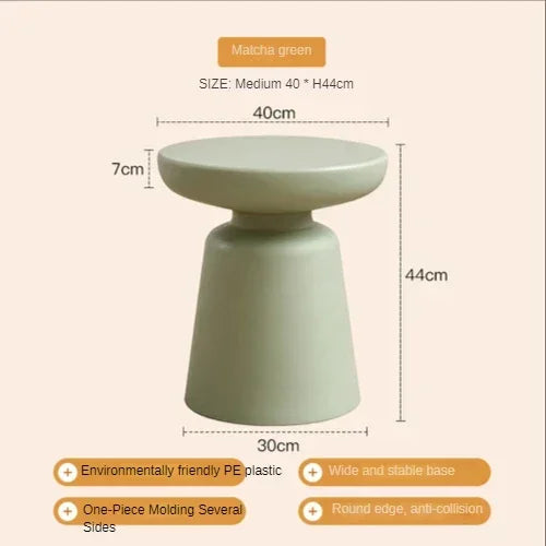 Matcha green compact size stool with smooth molded pe plastic body and rounded edges for living room coffee table use