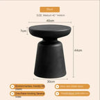 Black compact size coffee table for living room with sleek round top and wide base made of eco-friendly PE plastic