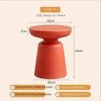 Orange-red coffee table stool with rounded top and wide base made of eco-friendly PE plastic for compact living room use
