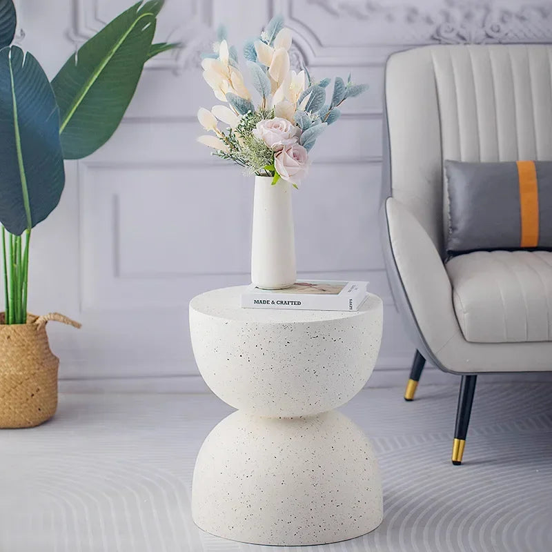 White speckled marble small coffee table designed as a modern living room side table with two stacked rounded sections