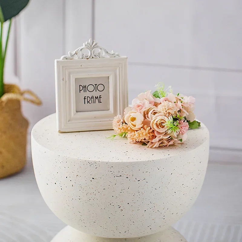 White ornate photo frame with delicate scrollwork and distressed finish complementing marble small coffee table living room decor