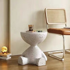 White speckled concrete coffee table with hourglass base and rounded top for living room marble small design
