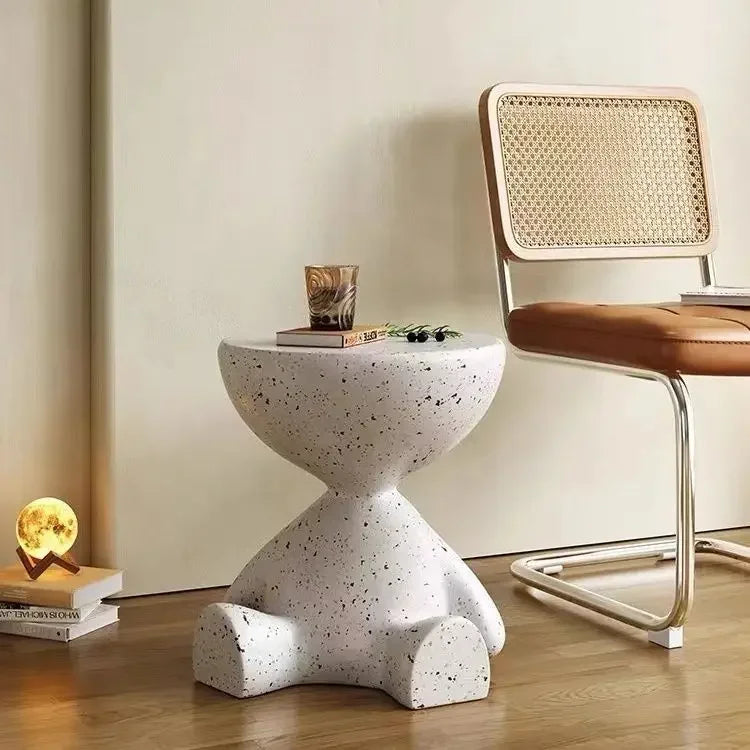 White speckled concrete coffee table with hourglass base and rounded top for living room marble small design