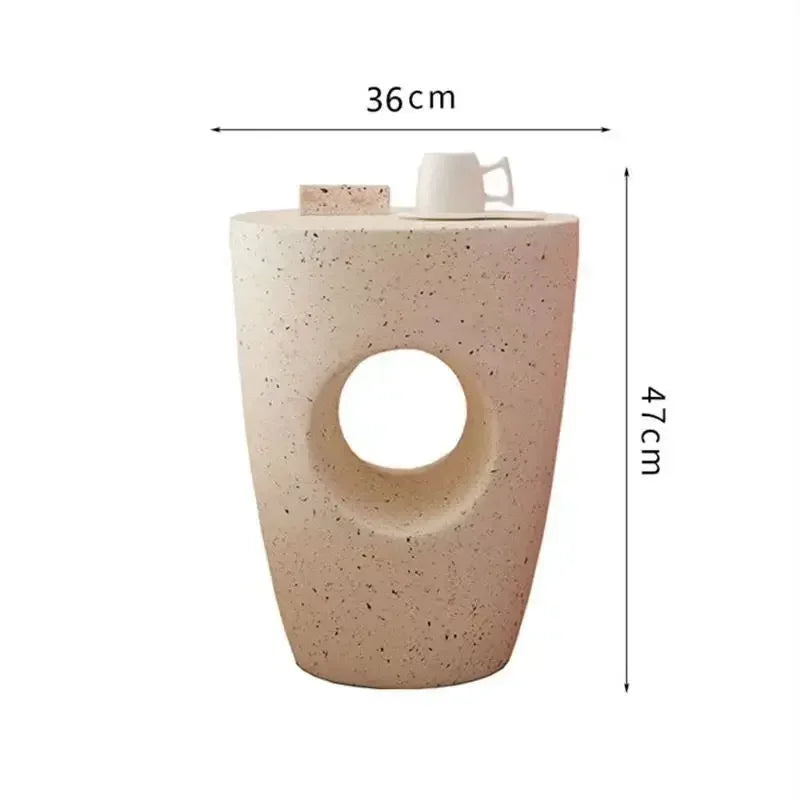 Beige speckled concrete coffee table marble small with circular cutout and minimalist design for living room use