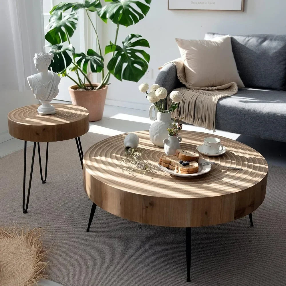 Rustic wooden coffee table with rounded top, black metal legs, and visible wood grain for living room use