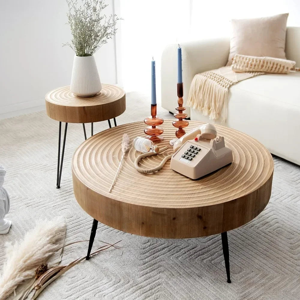 Rustic wooden coffee table with round top featuring concentric grooves and black metal legs for living room use