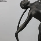 Black metallic desk statue featuring a stylized human figure with smooth contours for modern home office decor