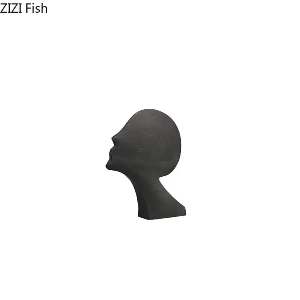 Dark gray ceramic desk statue of a human head in profile with modern design for home office decor