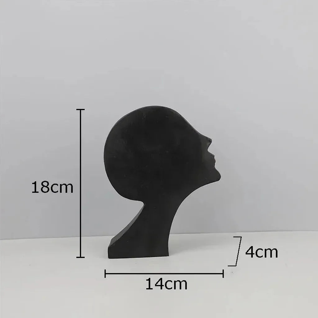 Black matte finished modern metal desk statue with sleek minimalist design ideal for home office decor