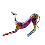 Vibrant graffiti-style doberman statue decorative piece with chrome accents ideal for living room display