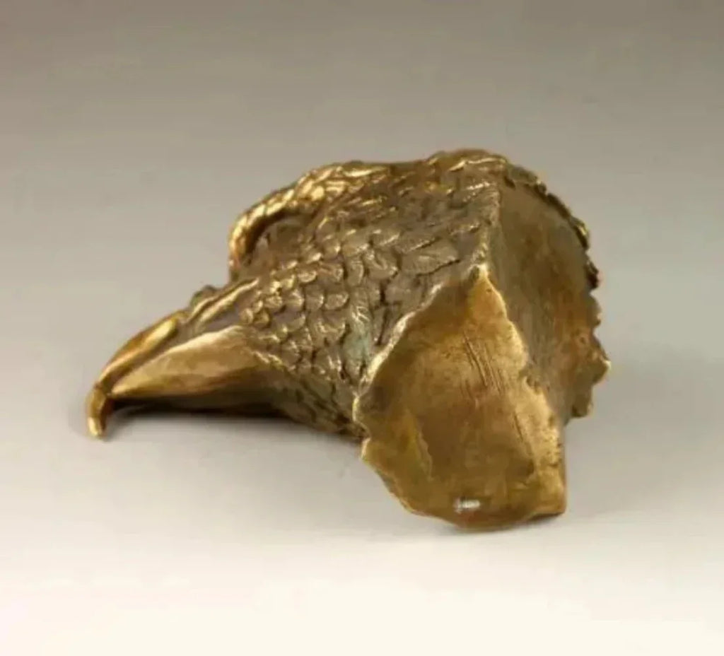 Bronze eagle sculpture decorative featuring detailed feather texture and sharp curved beak for elegant display