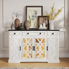 White sideboard with decorative items including vases and framed pictures in a room.