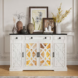 White sideboard with decorative items including vases and framed pictures in a room.
