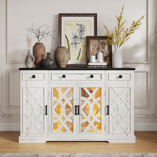White sideboard with decorative items including vases and framed pictures in a room.