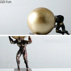 Figure statue fitness metal 12 inch featuring a black figurine lifting and pushing a golden metallic sphere for modern style home decor
