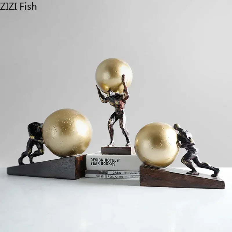 Bronze-colored fitness figure statue with muscular men pushing golden spheres on wooden bases modern style home decor