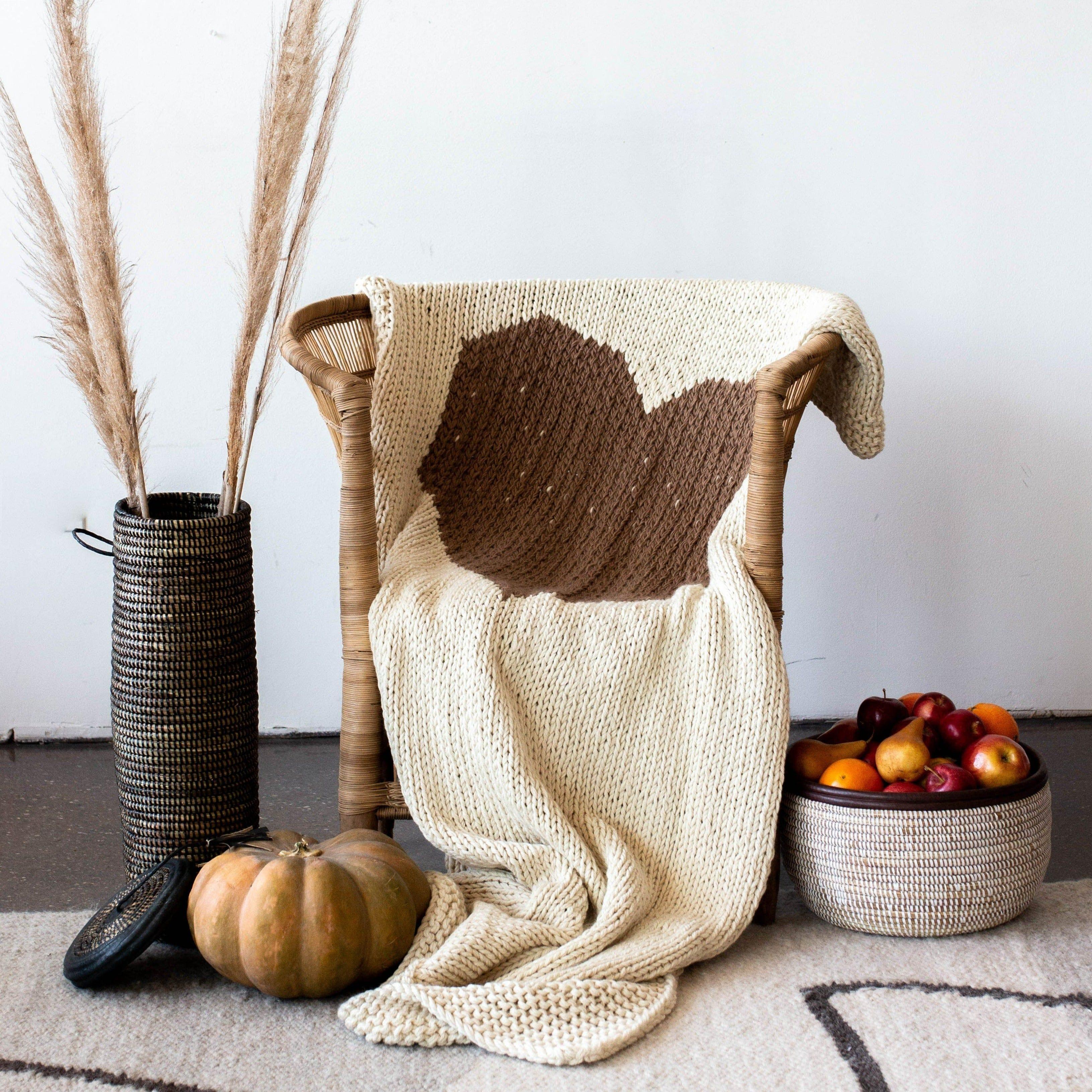 Hand-knitted Merino Wool Heart Throw Blanket, angled view - House Of Avana