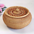 Woven basket with a lid on a white background